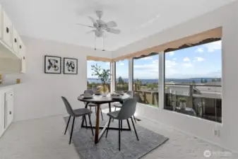 Formal dining area with a view! And a ceiling fan for those warm summer nights.