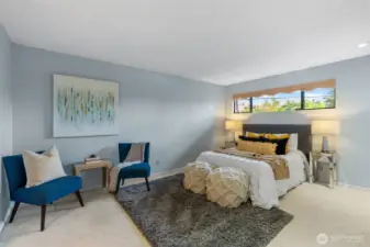 Primary bedroom is oversized to accommodate a sitting area or larger sized furniture. Also has double closets!