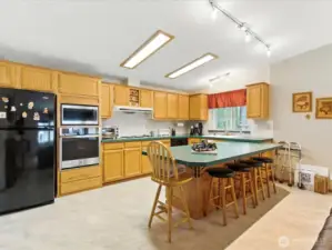 The open-concept kitchen is designed with both functionality and flow in mind, making everyday cooking a breeze.