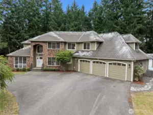 oversize 3 car garage with overhead racks