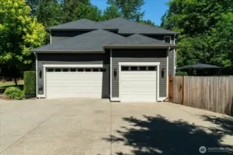 Oversized 3-car garage with side door entrance to back yard