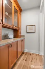 Ideal for hosting, the convenient butler's pantry acts as segue between kitchen and dining, and offers additional counter and cabinet space