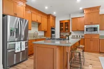 Chefs kitchen with large island and bar seating, offers plenty of counter space for prep