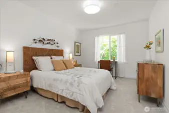 Nicely sized secondary bedroom, with walk-in closet, accommodates a queen-sized bed and dresser