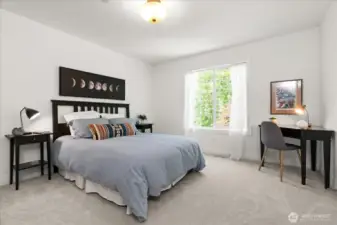 Generously sized additional secondary bedroom offers space for queen sized bed, dresser and desk.