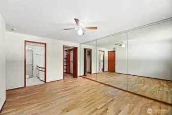 PRIMARY BEDROOM  Wall to wall mirror / Ceiling fan  Window overlooking rear yard  Beautiful original hardwoods floors
