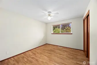 BEDROOM #2  Windows overlooking rear yard  Ceiling fans / Closet with slider door  Beautiful original hardwoods floors