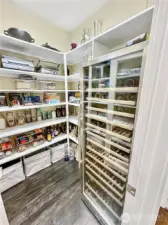 Huge Pantry offers tons of storage and wine refer.