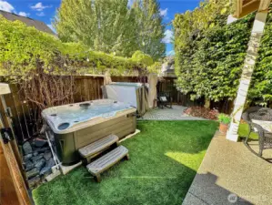 Exit slider to access wonderful rear yard, Private with hot tub and several sitting areas. Artificial turf for easy care.