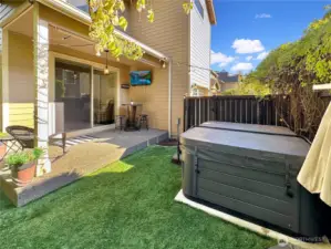 Sit in the hot tub and enjoy watching your favorite team play.  Great covered area just off of great room.