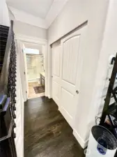 Hallway with storage leads to main floor bath.