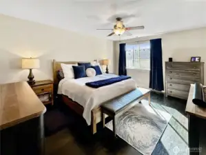 Stunning primary with hardwood floors and ceiling fan.  Large walk-in closet and luxury bath too.