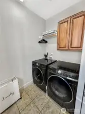 Nice laundry room on upper floor offers storage and laundry sink. Washer and Dryer included!
