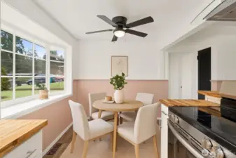 Great kitchen nook.  Could also place a bench style corner table to seat more people and use the large dining room as a second living room area, if desired