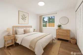 Another bedroom; also wood floors and dual closets