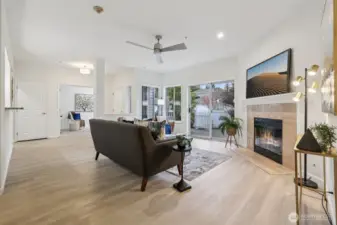 Gas Fireplace, Slider door to enclosed fenced patio, ceiling fan and new flooring
