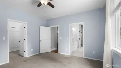 Primary Bedroom - Main Floor with view of walk-in closet