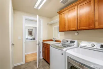Laundry room to garage with utility sink