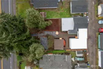 Tyler St on the left, alley access to garage and from walk up parking on right.