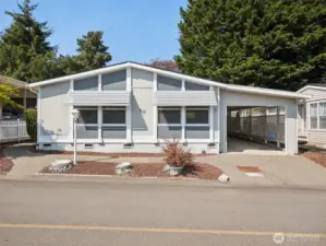 Front view of property, I LOVE the low-maintenance yard and the extra deep carport!
