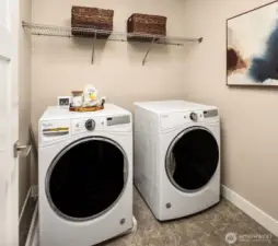 Convenient utility room with full size washer and dryer