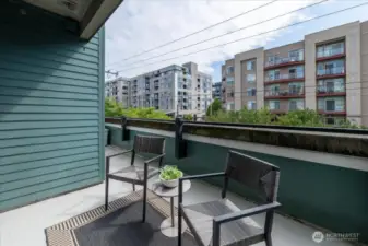 Balcony wraps around to primary bedroom window.