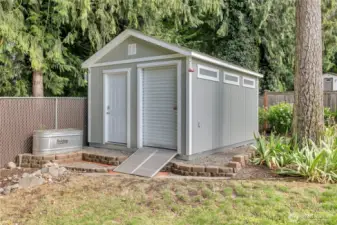 The second of two sheds with roll up doors for extra storage