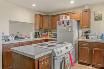Large kitchens with lots of counter space. Half bath and separate laundry space off kitchen with slider to the deck and back yard.