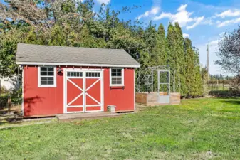 Outbuilding 1 has a manual awning. Greenhouse next to it just needs covering.