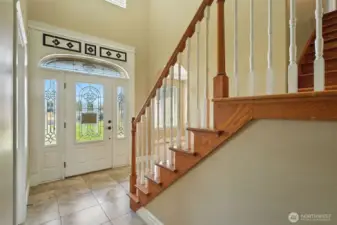 Welcome to this home. The entry opens the the open staircase and the living room. Office on the immediate right. Formal dining to the left.