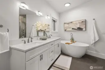 Designed for indulgence—the primary bath boasts dual vanities, a soaking tub, and an exquisite slab stone shower.