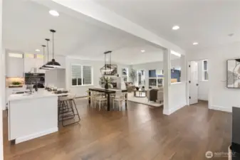 Open Main Level: Expansive open-concept design seamlessly connects the kitchen, dining, and living areas with natural light flowing throughout. Perfect for both casual gatherings and larger celebrations, this layout makes entertaining effortless.  These photos are of the actual, staged home being sold at Foxmoore. However, all photos, renderings, site maps, and floorplans are for visualization purposes only. Plans, colors, building orientation, finishes, home outlook, and other details can and WILL vary.