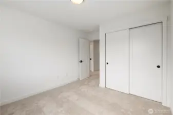 Upper Bedroom (alternate angle): Another view of the secondary bedroom highlights the generous closet space and connection to the upstairs hall. A versatile room ready to meet your needs.  These photos are of the actual, staged home being sold at Foxmoore. However, all photos, renderings, site maps, and floorplans are for visualization purposes only. Plans, colors, building orientation, finishes, home outlook, and other details can and WILL vary.
