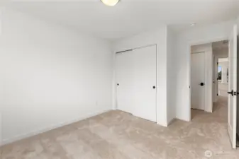 Upper Bedroom (alternate angle): Secondary bedroom with ample closet storage and easy access to the upstairs hall bath. A blank canvas for any lifestyle.  These photos are of the actual, staged home being sold at Foxmoore. However, all photos, renderings, site maps, and floorplans are for visualization purposes only. Plans, colors, building orientation, finishes, home outlook, and other details can and WILL vary.