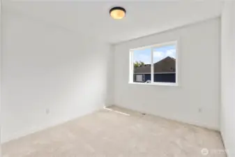 Upper Bedroom: Comfortable upstairs bedroom with bright natural light and plush carpet. Perfect for use as a guest room, office, or play space.  These photos are of the actual, staged home being sold at Foxmoore. However, all photos, renderings, site maps, and floorplans are for visualization purposes only. Plans, colors, building orientation, finishes, home outlook, and other details can and WILL vary.