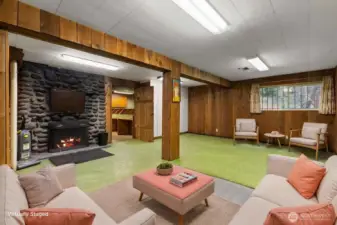 Huge bonus/rec room located on the main level features a wood burning fireplace, lower level features a separate entry and a chairlift to the main level.