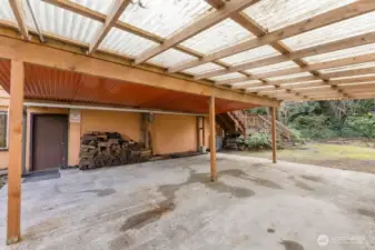 The home offers an attached carport plus room for RV parking and additional uncovered parking space.