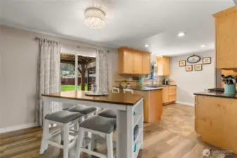 Dining area plus sit-up bar in kitchen.