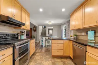 Granite counters and filtered instant water tap on sink.