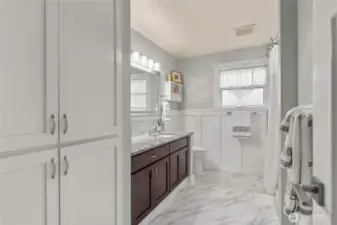 Fully remodeled main floor bath with tile tub shower. Toto toilet w/soft close seats