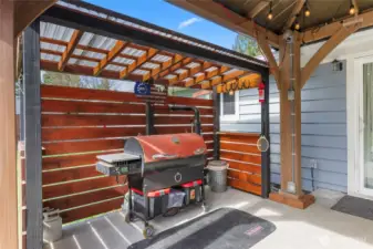 Enclosed and covered BBQ area.