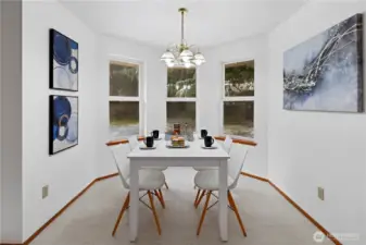 A beautiful, light, airy breakfast nook overlooking the back yard