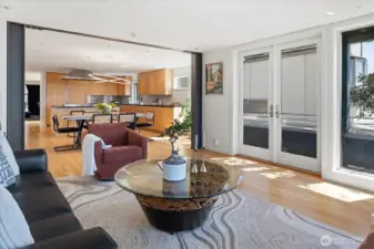 Living room looking to the kitchen and dining area