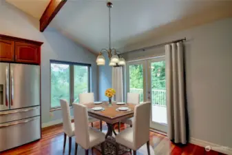 Kitchen opens to dining area.  (virtually staged)