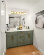 Full bath serves two additional bedrooms on upper level