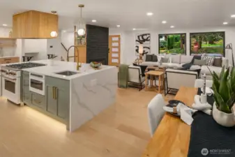 Engineered light wide plank light oak flooring throughout creates seamless flow