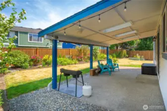 The covered patio also offers a cooling retreat while still getting to enjoy the wonderful backyard oasis.
