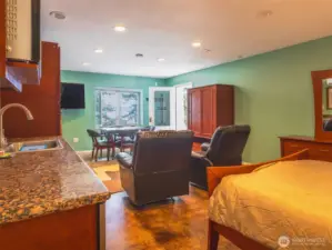 Lower level living quarters with second bedroom, full bath, living area & dining area.