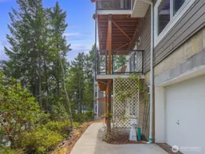 Access to outside from lower living area. Water equipment storage at right.