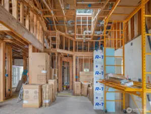 Photo showing the pantry straight ahead and the front door of to the left. Mud room is to the right behind the kitchen.